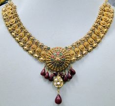 "Vintage antique 22 ct solid gold, Diamond necklace. Fully detailed handcrafted set with Diamonds ,attached genuine Ruby gemstones drops. Center Floral design deorated with multicolor enamel work. Collection piece in very good condition. Total length-40 cm(16\") we can adjust length, Width including dangles-6 cm(2.36\"), total weight-26 grams(0.91 ounces), material-22 ct solid gold , Diamonds , enamel , Rubies." Indian Bridal Choker, Bridal Choker Set, Temple Necklace, Work Necklaces, White Gold Pendant Necklace, Necklace Set Indian, Bridal Choker, Bangles Jewelry Designs, Gold Bead Necklace