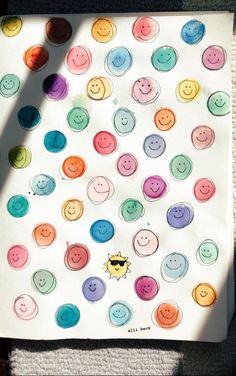 a white paper with colorful buttons on it