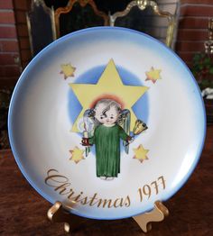 a christmas plate with an angel on it