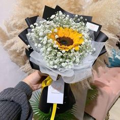 a bouquet of sunflowers and baby's breath