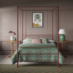 a bedroom with a bed, nightstands and paintings on the wall behind it in shades of green