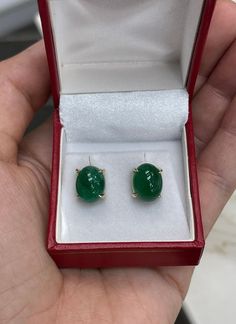 Featured here is a beautiful set of oval cut cabochon emerald studs in fine 14K yellow gold. Displayed are rich-green emeralds with very good transparency, accented by a simple four-prong claw gold mount, allowing for the emerald to be shown in full view. The earth mined, green cabochon emeralds have a desirable lush green color with excellent qualities. These earrings are ideal for everyday use and are the perfect accessory to any outfit. Emerald Studs, Emerald Stud Earrings, Emerald Cabochon, Cabochon Earrings, Emerald Earrings Studs, Tiny Bow, Colombian Emeralds, Rich Green, Emerald Earrings