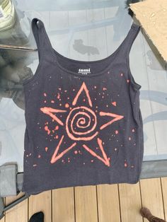 a tank top with an image of a star on it