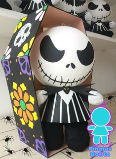 a stuffed animal in a box with halloween decorations