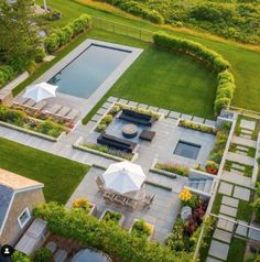 an aerial view of a backyard with lawn, pool and gazebo in the middle