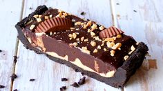 a piece of chocolate cake with nuts on top