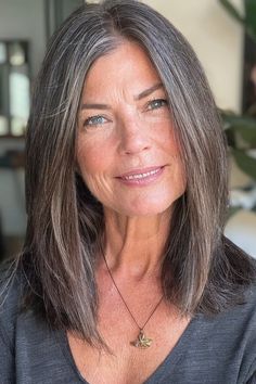 Posh and pretty, you can’t go wrong with an angled lob. To give this hairstyle an added sense of structure and refinement, use a glossy hair product and a flat iron to achieve a new level of sleek straightness. Click here to check out more best long hairstyles for women over 60. How To Grow Out Grey Hair Gracefully, Straight Hair Natural, Long Hair Over 60 Aging Gracefully, Haircut Gray Hair, Grey Hair Over 50, Hair Highlights And Lowlights, Grey Hair Styles For Women, Glossy Hair