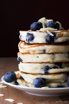 a stack of pancakes with blueberries on top