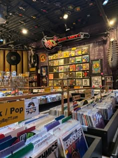 there are many records on the shelves in this music store that is full of cds