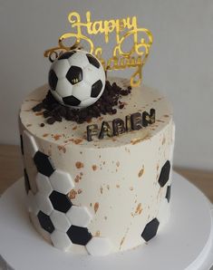 a birthday cake with a soccer ball on top