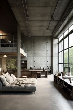 a living room filled with lots of furniture and large windows next to a tall building