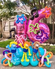 balloons are arranged in the shape of numbers and characters for an outdoor birthday party or celebration