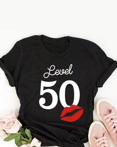 a t - shirt that says level 34 with lipstick on it