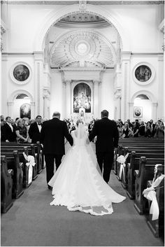 the bride and groom are walking down the aisle