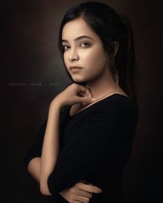 a woman posing for a photo with her arms crossed