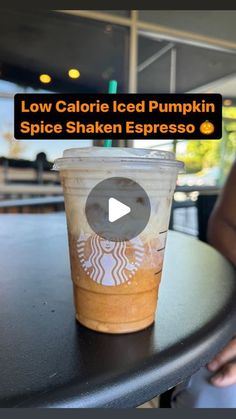 a cup of coffee with the words low calorie iced pumpkin spice shaken espresso