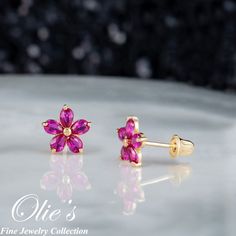 Introducing our 14K Flower Ruby Screw Back Earrings! These Solid Yellow Gold Red Floral Earrings are perfect for those who love minimalist studs with a touch of elegance. The earrings features a sparkling clear cubic zirconia in the center of the flower and 6 beautiful ruby cubic zirconia stones on the side that will add a pop of color to any outfit. These earrings are perfect for July Birthdays as ruby is the birthstone for July. The screw back design ensures that these earrings will stay secur Pink Ruby Flower-shaped Jewelry, Red Flower Earrings For Formal Occasions, Pink Flower Earrings For Mother's Day Anniversary, Red Flower Earrings For Anniversary, Red Flower-shaped Earrings For Anniversary, Pink 14k Gold Wedding Earrings, Rose Red Flower Earrings For Wedding, Pink Flower Jewelry For Celebration, Rose Red Flower Wedding Earrings