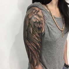 a woman with a tattoo on her arm