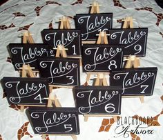 wooden table numbers are placed on top of each other