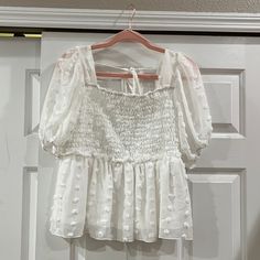 White Birch White Baby Doll Style Blouse. Nwot, Size Large, Great Stretch In Chest Area. 22” From Shoulder To Bottom Hem, 17” From Neckline To Bottom Hem. Fitted White Swiss Dot Top, Cute White Tops With Smocked Bodice, White Short Sleeve Blouse With Smocked Bodice, White Blouse With Smocked Bodice And Short Sleeves, White Birch, Style Blouse, White Tops, Baby Doll, Baby Dolls