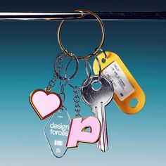 the design forces keychain is shaped like a heart and has four keys attached to it