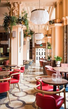 the inside of a restaurant with tables and chairs