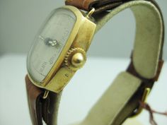 "For Sale: (1) b715 Unisex Vintage Swiss 14kt Yellow Gold Mechanical Wristwatch PLEASE READ ENTIRE DESCRIPTION BEFORE PURCHASING This is a vintage Swiss mechanical wristwatch. Simple dial. Crystal and dial are in good shape. Bezel has some small scratches. Would make a nice Birthday, Christmas, Father's Day or Valentine's Day present. Please see pictures for more details! Specifics: Swiss made Mechanical Case width: 27mm Lug width: 16mm Thickness: 8.255mm Band measures: 8 15/16\" Weight: 27.7g I Antique Yellow Gold Watch Bands For Formal Occasions, Antique Yellow Gold Analog Watch, Antique Analog Watch For Formal Occasions, Antique Formal Analog Watch, Timeless Yellow Gold Analog Watch Accessories, Valentines Day Presents, Filigree Ring, Silver Chain Necklace, Saint Louis