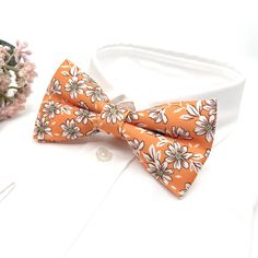 ■ Orange Floral Bow tie, Wedding Floral Bow tie, Groomsmen Bow ties, Wedding Bow tie, Groom Gift, Pale orange Bow tie, Groom Bow tie  At our Etsy shop"uniqueminashop" we offer a wide range of handmade bow ties and neckties that are perfect for any occasion. Our bow ties are made with high-quality materials and come in a variety of colors, patterns, and styles to suit any taste. Our neckties are also made with care and attention to detail, and are sure to add a touch of class and sophistication t Formal Orange Bow Tie, Orange Bow Tie, Bow Tie Groom, Groom Bow Tie, Bow Tie Groomsmen, Groom Bowtie, Wedding Bow Tie, Groomsmen Bowtie, Floral Bow Tie