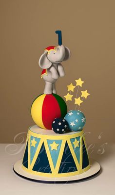 an elephant on top of a circus themed cake