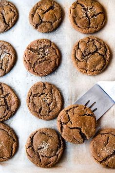 chocolate chip cookies on a baking sheet with a spatula