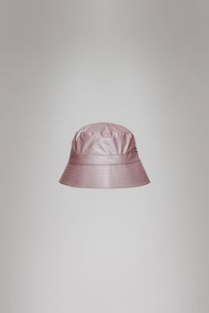 Bucket Hat is Rains' take on the classic headwear icon with new interpretations. The Bucket Hat is characterized by a lower and more vertical rim, finished with stitch details. The design is lined with a soft breathable fabric for improved comfort and fit. Bucket Hat is cut from Rains' signature PU fabric. The finish is lightweight with a smooth feel. Bags Makeup, Pu Fabric, Dress Makeup, Over 50, Breathable Fabric, Muse, Bucket Hat, Couture, Hats