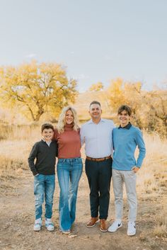 a family posing for a photo in the desert