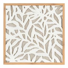 a wooden frame with white leaves on it