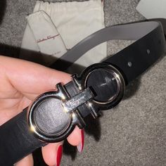 Authentic Salvatore Ferragamo reversible belt. could be worn on the black side or grey side. 

pretty new only worn maybe once. 

does have some tiny scratches on the metal part but not noticeable.

come with only the pouch and a protective small pouch for the clasp. 

Pm for any questions!
#accessorize #belt #fashion #ferragamo Belt Fashion, Small Pouch, Reversible Belt, Small Pouches, Black Side, Women's Belt, The Pouch, Belts For Women, Salvatore Ferragamo