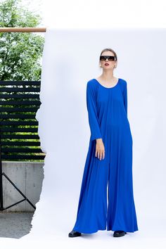 "Royal Blue Wide Leg Jumpsuit, Long Sleeve Jumpsuit, Maxi Jumpsuit in Blue The Maxi Jumpsuit - the most comfy women clothing! All sizes available - if you need a plus size jumpsuits here is the place where you can find yours. This Extravagant, but stylish maxi jumpsuit is sure to make a head-turning entrance with its chic design and comfy and easy to wear style ! A chic trend for the fall / winter / spring - wide-leg trousers to channel the silhouette of the season ! The maxi jumpsuit can be wor Blue Relaxed Fit Jumpsuits And Rompers For Beach, Blue Long Sleeve Jumpsuits And Rompers For Beach, Trendy Denim Blue Wide-leg Jumpsuits And Rompers, Blue Wide-leg Jumpsuits And Rompers For Day Out, Blue Full-length Summer Jumpsuits And Rompers, Blue Maxi-length Kaftan For Loungewear, Blue V-neck Relaxed Fit Jumpsuit, Grey Maxi, Maxi Jumpsuit