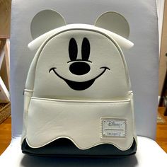 Disney Halloween Glow In The Dark Mickey Loungefly Backpack Themed White Backpack For Everyday Use, White Mickey Mouse School Backpack, White Mickey Mouse Backpack For Disney Trips, White Mickey Mouse Travel Backpack, White Mickey Mouse Backpack For Travel, White Mickey Mouse Bag For Disney Fan Events, Disney Halloween Backpack For Disney Trips, White Halloween Backpack For Travel, Halloween White Backpack