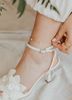 We are head over ankles for pearls! This cable pearl anklet is adorned with the most preciously placed pearls making for a dreamy ethereal feel. A summer must-have. Choose from two sizes: 8.5"-9" and 9.5"-10". Available in 14kt Gold Fill + Sterling Silver. Shown with our Stella Anklet. Handmade in Eau Claire, WI. Our jewelry is handmade so each piece will be unique and may vary slightly from what is pictured. Elegant Pearl Anklets For Party, Elegant Pearl Chain Anklet For Party, Elegant Pearl Anklets With Pearl Chain, Elegant Pearl Chain Anklets, Adjustable Minimalist Pearl Chain Anklet, Elegant Pearl Anklets For Wedding, Dainty Adjustable Anklets For Wedding, Elegant Pearl Chain Anklets For Wedding, Elegant Wedding Anklets With Pearl Chain