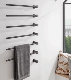 there is a towel rack on the wall