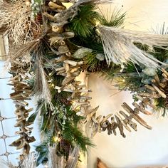 a christmas wreath with pine cones and other decorations