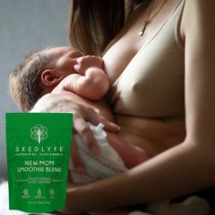 a woman holding a baby in her arms with a seedly life packet on it