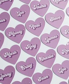 many hearts with names on them are arranged in the shape of small heart shaped stickers