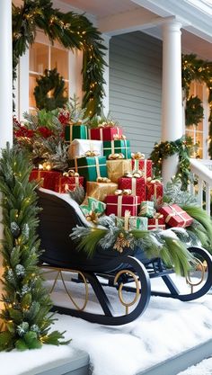 a sleigh filled with presents sitting in front of a house