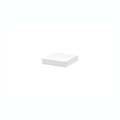 a white square object sitting on top of a white surface with no one around it