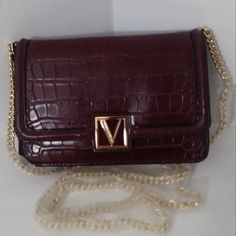 Victoria Secret Cross Body Bag Gorgeous Burgundy Crocodile Print Multi Pocket Snap Front. Interior: Center Zip Pocket Separated Both Compartment One With A Card Holder Other Side With Several Card Holders. A Victoria Secret Snap On Charm, With A Gold Tone Chain. Exterior: Back Slide Compartment. Magnetic Closure. Mirror Included 7 ¼ L X 4.5” H X Strap Drops 23” Brand New With Tag Studded Purse, Crocodile Print, Pink Handbags, Victoria Secrets, Cross Bag, Chain Crossbody Bag, Tote Bag Purse, Classic Backpack, Travel Jewelry