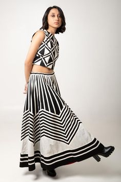 Monochrome flared midi skirt with striped applique work in cotton base.
Components: 1
Type Of Work: Stripe
Fabric: Cotton
Color: Black,White
Other Details: 
Attached lining
Closure: Drawstring
Note: Top and inner pant worn by the model are not for sale.
Occasion: Party - Aza Fashions Striped Cotton Midi Skirt, Chic Striped Cotton Skirt, Black Cotton Long Dress, Black Cotton Dress With Long Skirt, Flared Cotton Skirt For Party, Chic Cotton A-line Maxi Skirt, Chic A-line Cotton Maxi Skirt, Black And White Crop Tops, Flared Midi Skirt