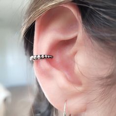 Beautiful handcrafted sterling silver ear cuff features brightly-finished granulation details in an oxidized channel in 925 sterling silver. It has a curved design that closely fits the edge of the ear. Ear cuffs is perfect as a gift for a woman, girl or men, Christmas gift, birthday or her special day. Ear cuffs are worn along the outer edge of the ear and simply slide on, hugging the curve to stay in place.  ♥ Details: Dimensions: 14mm. Metal type : Sterling silver. Karat/purity : 925. Style: Ear cuff. ♥ Packaging: All jewels come in a beautiful package with a bow, ready to give away. Dimensions: 3.50 x 3.50 x 0.87 Inches ♥ Do you have a question?  Feel free to contact me directly by sending me a message. ♥We make custom pieces with 925 sterling silver ♥♥ ♥We can design specially for you Cheap Silver Small Hoop Ear Cuff, Ear Cuffs No Piercing Sterling Silver, Upper Ear Earrings, Ear Weights, Mini Hoop Earrings, Silver Ear Cuff, Cuff Earrings, Types Of Metal, Mens Gifts