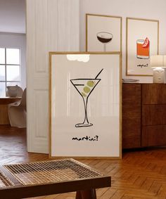 there is a poster with a martini in it on the floor next to a table