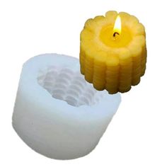 a candle that is sitting on top of a piece of wax