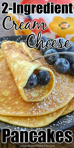 two ingredient cream cheese pancakes with blueberries on top and the title overlay reads, 2 ingredient cream cheese pancakes