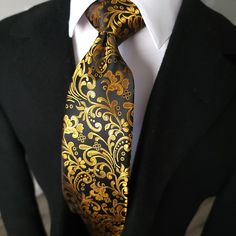 Black Gold Floral Silk Tie Pocket Square Cufflink Set - STYLETIE Black Suit Gold Accent, Elegant Ties For Black-tie Events, Elegant Ties With Pocket Square For Black-tie Events, Elegant Black Suit And Tie Accessories With Pocket Square, Elegant Black Tie Pocket Square, Luxury Gold Tie For Formal Occasions, Classic Gold Suit And Tie Accessories For Black Tie, Luxury Gold Tie For Black Tie Events, Classic Gold Tie For Formal Occasions